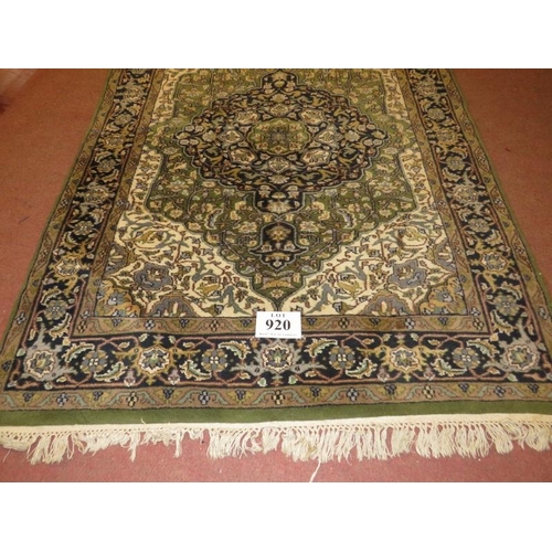 920 - A Persian carpet, central medallion on green ground, 182cm x 127cm.
Condition report: Generally in g... 