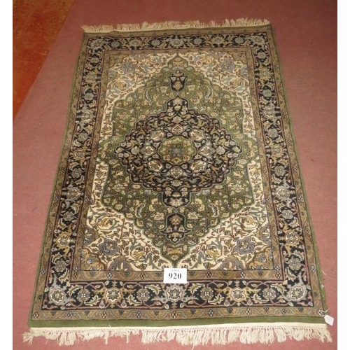 920 - A Persian carpet, central medallion on green ground, 182cm x 127cm.
Condition report: Generally in g... 