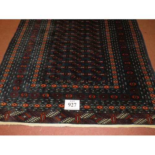 927 - A 20th Century Persian rug, overall repeat pattern on blue ground, 191cm x 130cm.
Condition report: ... 