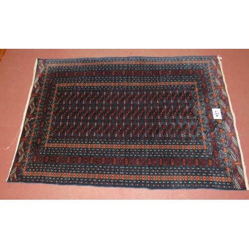 927 - A 20th Century Persian rug, overall repeat pattern on blue ground, 191cm x 130cm.
Condition report: ... 