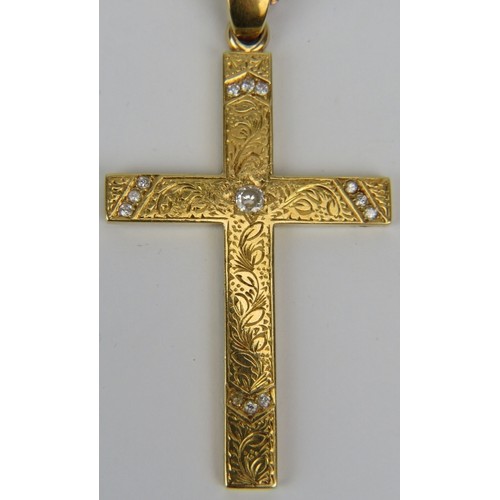 348 - A large 18ct yellow gold cross with engraved decoration & set with centre diamond and twelve smaller... 