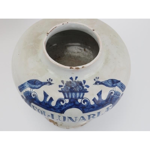 100 - A Dutch Delft apothecary jar, 18th century. Of compressed globular form with a splayed circular foot... 