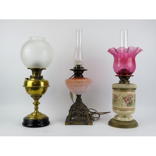 109 - Three British antique brass, ceramic and glass oil lamps, late 19th/early 20th century. Comprising a... 