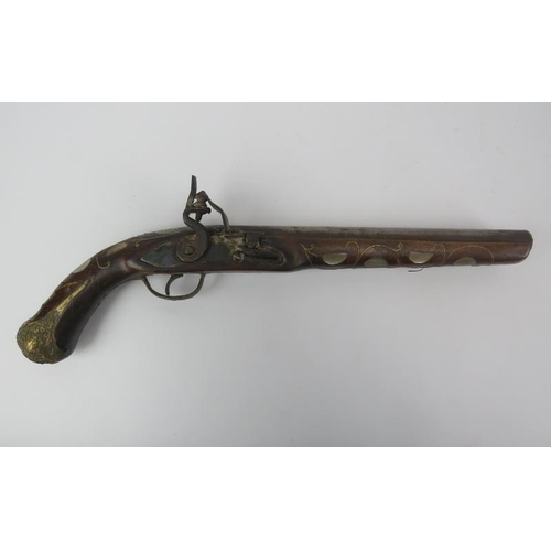 114 - A vintage replica 18th century style flintlock pistol. With foliate brass and mother of pearl decora... 