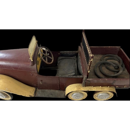 118 - Toys: A vintage children’s pedal car, mid 20th century. The car was likely to have been produced in ... 