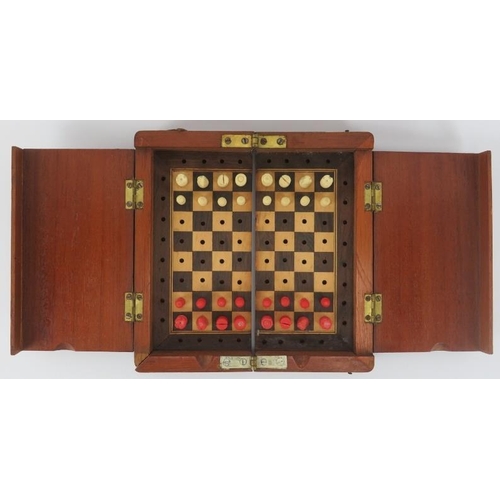 121 - A travellers miniature cased chess set, early 20th century. The box unfolds to reveal a set of turne... 