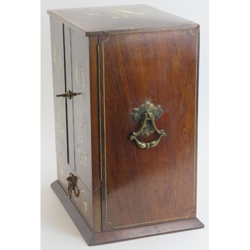 138 - Tobacconalia: An Edwardian rosewood and marquetry inlaid smokers cabinet. Decorated with cherubs, my... 