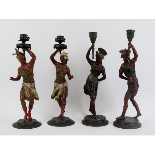 16 - Two pairs of Continental cold painted spelter figural candlesticks, late 19th century. Each pair mod... 