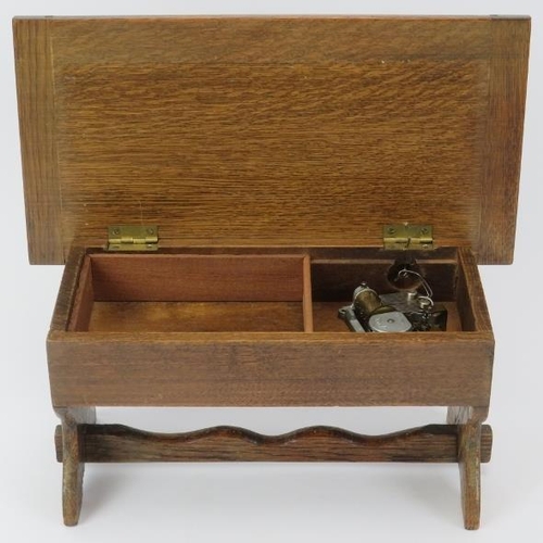 164 - A novelty oak music box formed as a refectory table, 20th century. With a Labor Swiss mechanical mov... 