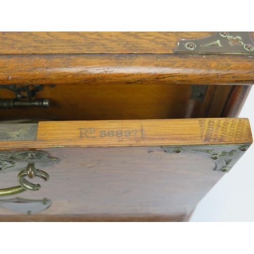 187 - A late Victorian brass mounted oak desktop stationary box. With internal letter rack, draw, pen hold... 