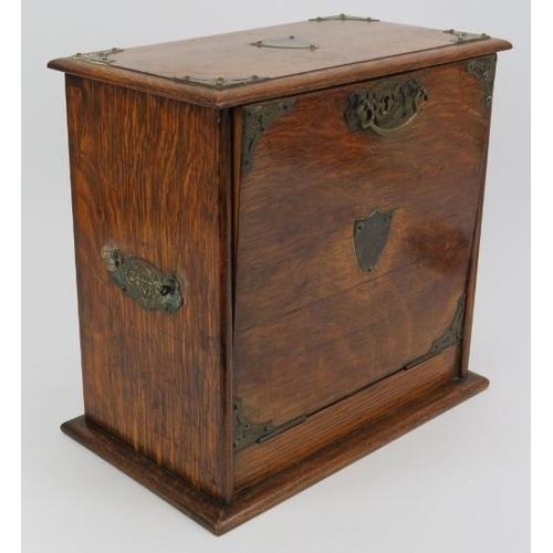 187 - A late Victorian brass mounted oak desktop stationary box. With internal letter rack, draw, pen hold... 