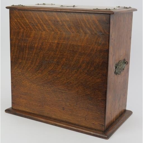 187 - A late Victorian brass mounted oak desktop stationary box. With internal letter rack, draw, pen hold... 