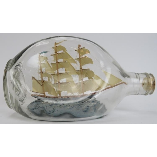 201 - A vintage model Clipper ship in a glass Haig’s whisky bottle by ‘Ship Models’ of Robin Hood Bay. 20 ... 