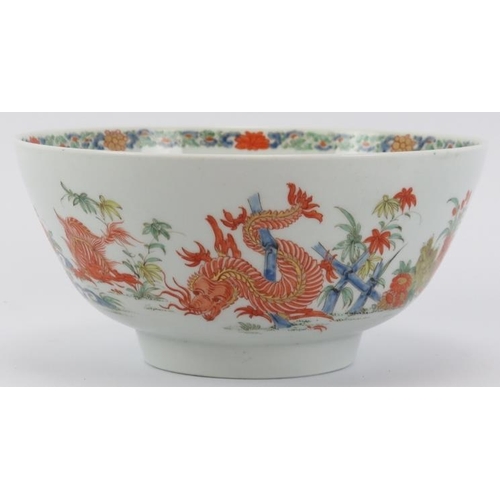 206 - A rare Worcester Kakiemon dragon bowl, mid 18th century. Finely overglaze painted with a continuous ... 