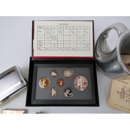 210 - A mixed lot of collectables. Notable items include a F. Barker & Son WWI military compass, a Royal C... 