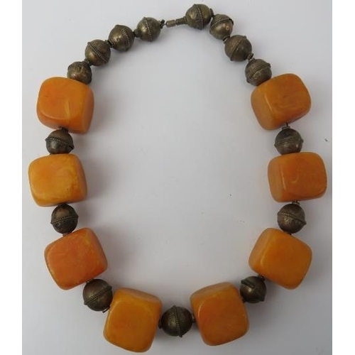 214 - Tribal Art: An African simulated amber cube beaded necklace. 2.4 cm approximate length of each cube.... 