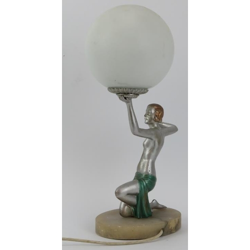 219 - An Art Deco painted metal dancing female figure table lamp, circa 1920s/30s. With a spherical glass ... 