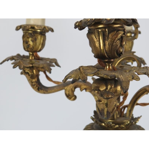 225 - A large gilt bronze and porcelain five branch candelabra, early 20th century. 85.5 cm total height i... 