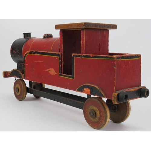 238 - Toys: A vintage Lines Bros Ltd LMS Model Train. Painted wood with tin wheels and fittings. 55.5 cm l... 