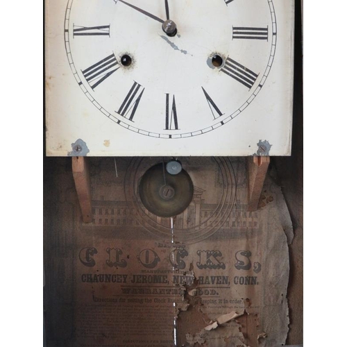 243 - An American mahogany wall clock by Chauncey Jerome of Newhaven, 19th century. 63 cm height.
Conditio... 