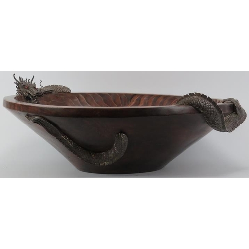 253 - A large Chinese carved teak wood and white metal dragon centrepiece bowl, late 20th/early 21st centu... 