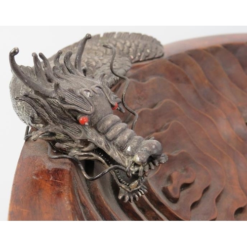 253 - A large Chinese carved teak wood and white metal dragon centrepiece bowl, late 20th/early 21st centu... 