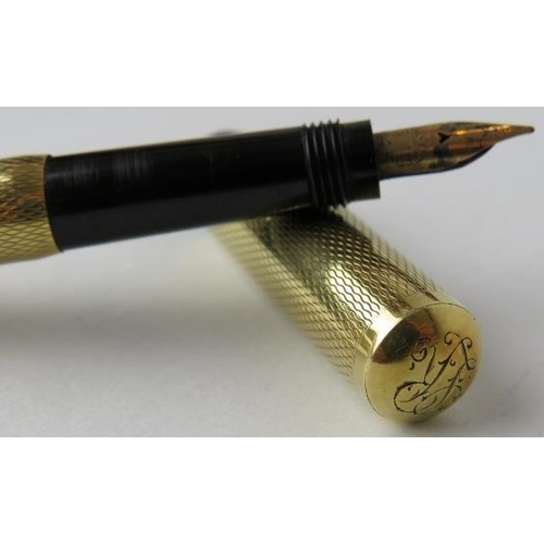 307 - A small 14ct gold retractable fountain pen, possibly by Mont Blanc. The cap is marked 585 and the en... 