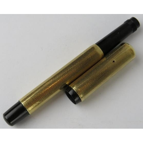 307 - A small 14ct gold retractable fountain pen, possibly by Mont Blanc. The cap is marked 585 and the en... 