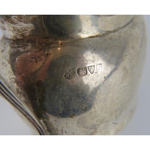 323 - A silver Georgian style cream jug, hallmarked for Chester, maker and date letter rubbed. Height 8cm.... 