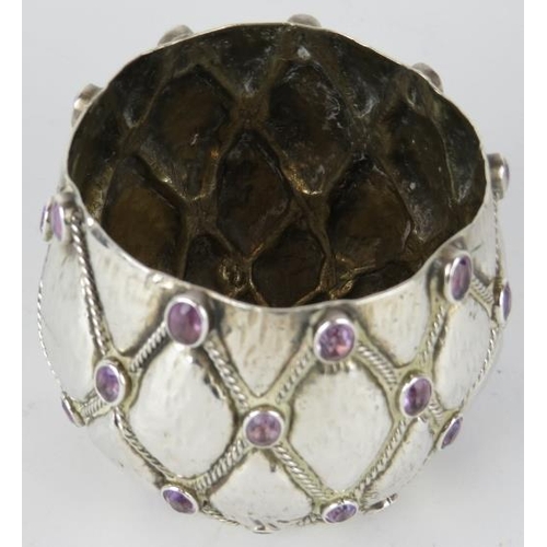 329 - An attractive white metal pot with applied amethyst stones set into a latticework decoration.  Marke... 