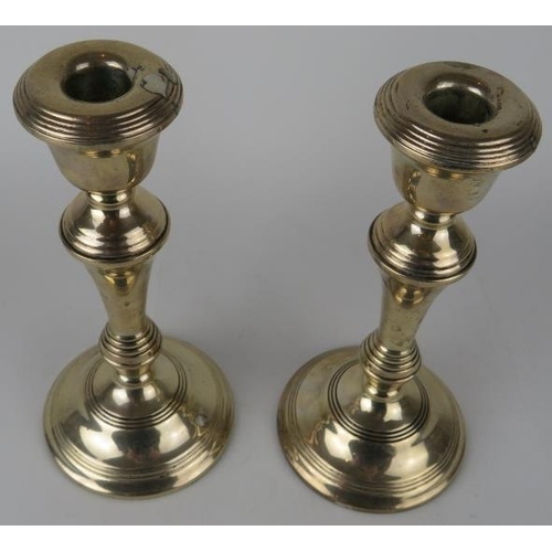 342 - A pair of silver column candlesticks, hallmarked for Birmingham 1970, maker Broadway & Co. Height 21... 