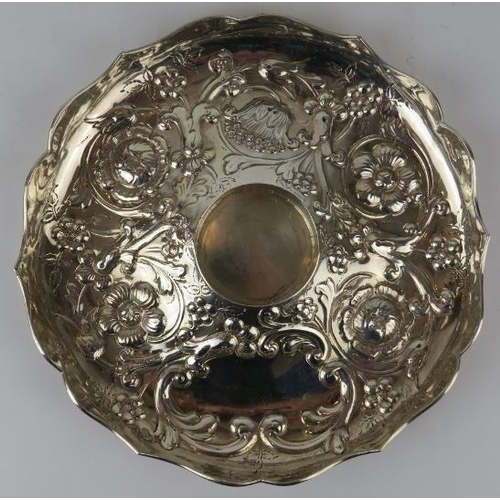 343 - A late 19th century repousse silver dish with floral decoration. Hallmarked for London 1893, maker A... 