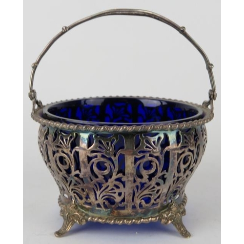 344 - A pierced silver bonbon basket with blue glass liner, hallmarked for Birmingham 1935 (Jubilee mark),... 