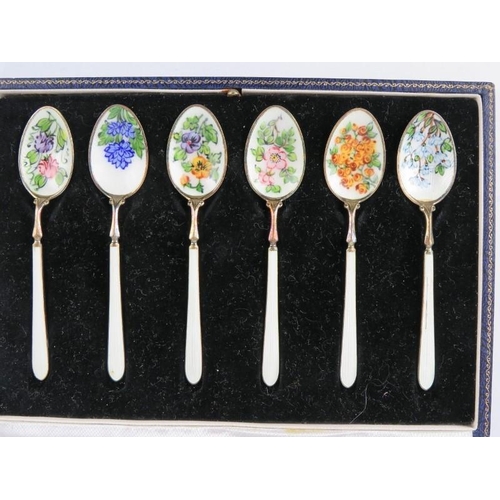 345 - A boxed set of six silver gilt coffee spoons enamelled with flowers, hallmarked for Birmingham 1963,... 