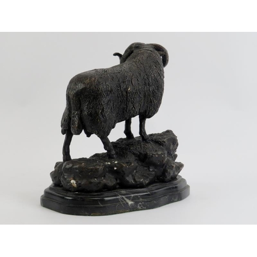 35 - A bronzed metal figure of a ram on a rocky outcrop, 20th century. Supported on a marble base. 21.3 c... 