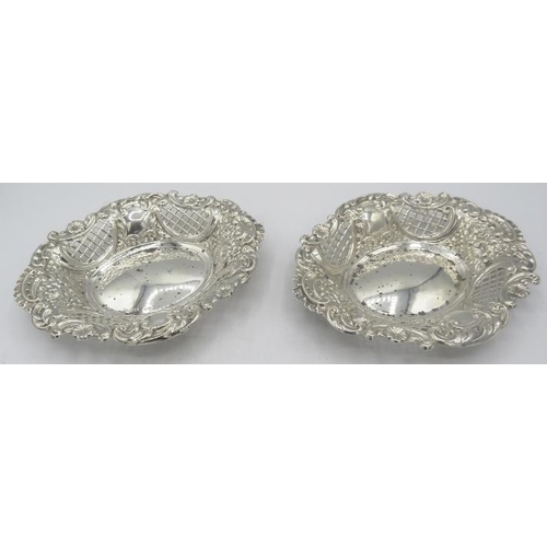 352 - A pair of oval silver bon bon dishes with flower, scroll and pierced decoration, Chester 1897. Appro... 