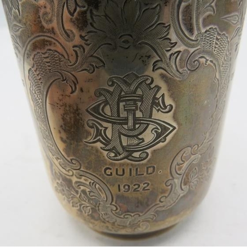 353 - A silver christening mug with 'C' shaped handle and foliate engraved decoration, monogrammed, Sheffi... 