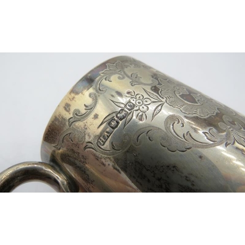 353 - A silver christening mug with 'C' shaped handle and foliate engraved decoration, monogrammed, Sheffi... 