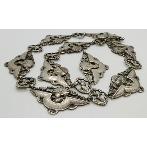 370 - A Vintage Silver metal necklace with embossed trophies/plaques, stamped 800, 400mm long.44.4gms. All... 