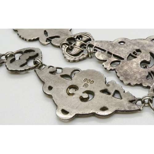 370 - A Vintage Silver metal necklace with embossed trophies/plaques, stamped 800, 400mm long.44.4gms. All... 