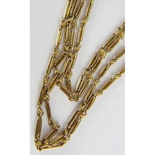 392 - A 9ct gold long guard chain 140cm long, 34.9gms. All weights measurements and sizes are approximate.