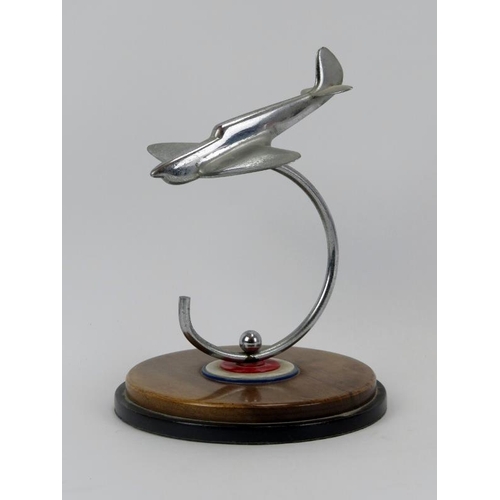 46 - Aviation memorabilia: An RAF Spitfire desktop ornament, mid 20th century. Modelled in chrome and sup... 