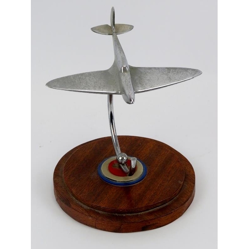 48 - Aviation memorabilia: An RAF Spitfire desktop ornament, mid 20th century. Modelled in chrome and sup... 