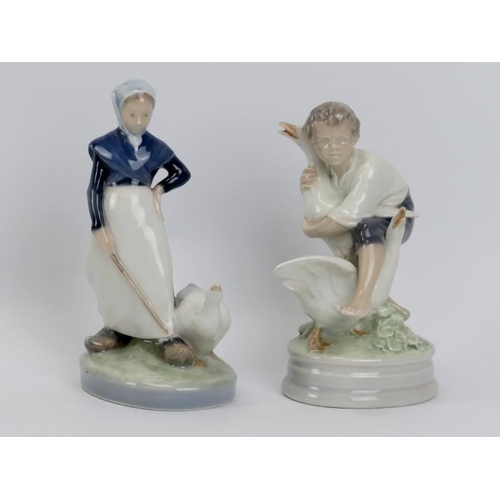 51 - Two Royal Copenhagen porcelain figurines. Comprising a young woman and goose, numbered 528 and boy w... 