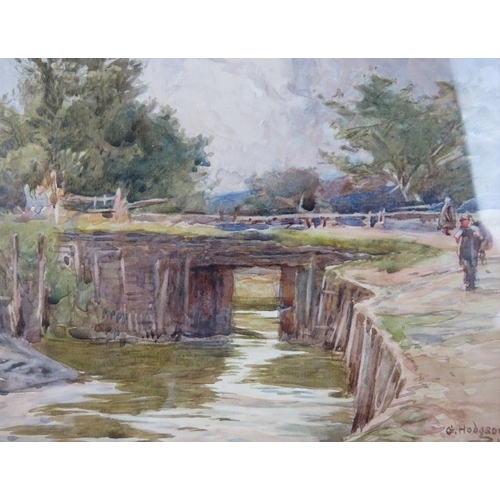 523 - George Hodgson (1847-1921) - A framed & glazed watercolour, 'Figures by a country river', signed low... 