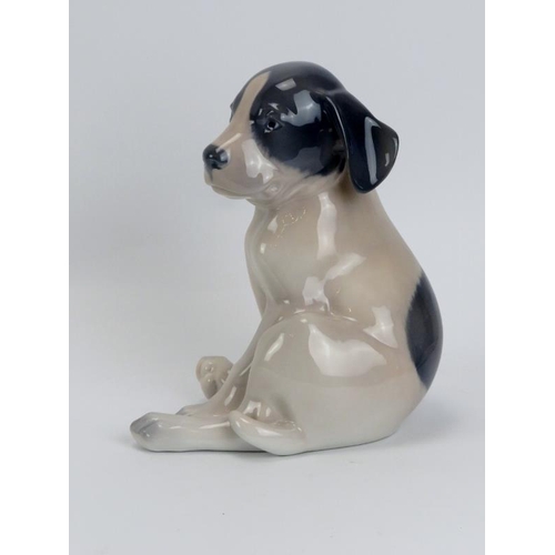 53 - A large Royal Copenhagen porcelain pointer puppy figurine. Numbered 259. 19.5 cm height. 
Condition ... 