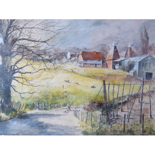 569 - Esme E Crockford - A framed & glazed watercolour, 'Kent country scene with hop farm & man on a path ... 