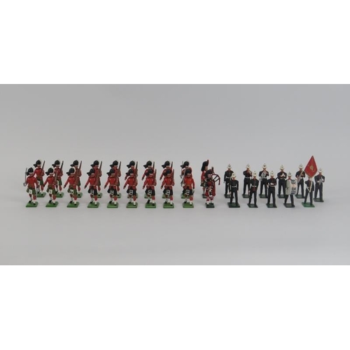 58 - A group of vintage cold painted metal British model soldier figures. Britains Highlander figures inc... 