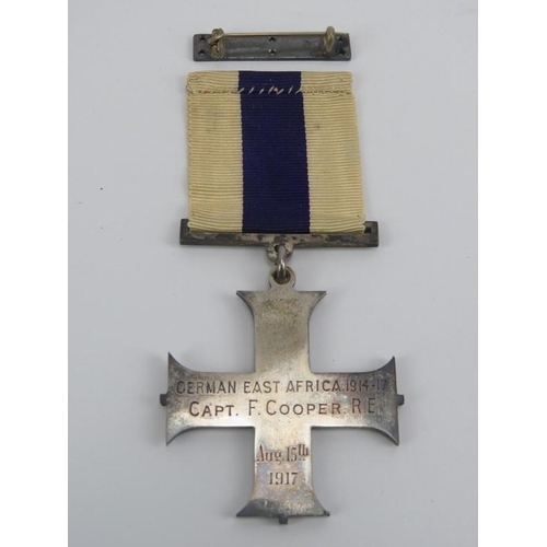 61 - A WWI British Military Cross. Inscribed ‘German East Africa 1914-17 Capt. F. Cooper R.E. Aug. 15th 1... 