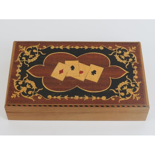 62 - A vintage marquetry inlaid playing cards box, early/mid 20th century. The hinged cover marquetry inl... 